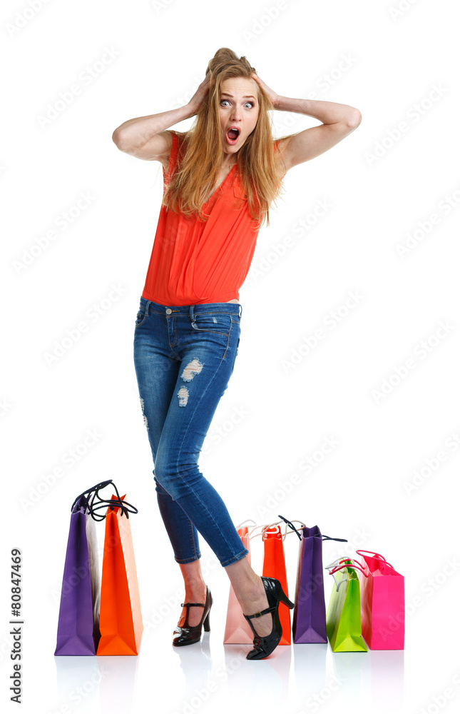 Happy lovely woman with shopping bags over white Happy lovely woman with shopping bags over white