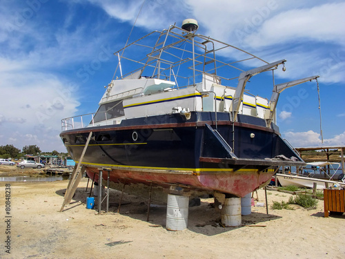 repair of a large ship in dry dock, Cyprus © vladislav333222