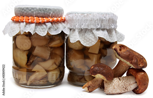 Marinaded mushrooms isolated on white background.