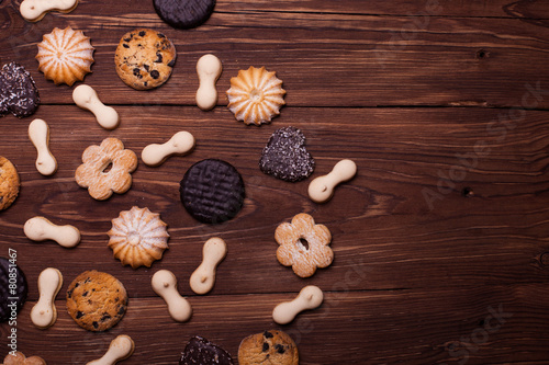 Various cookies on the wooden table