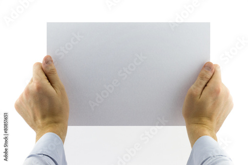 Close-up view of male hands holding blank white paper