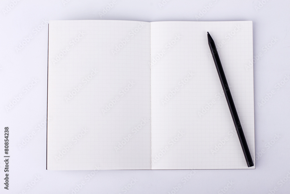 Open notebook on white background Open notebook on white background