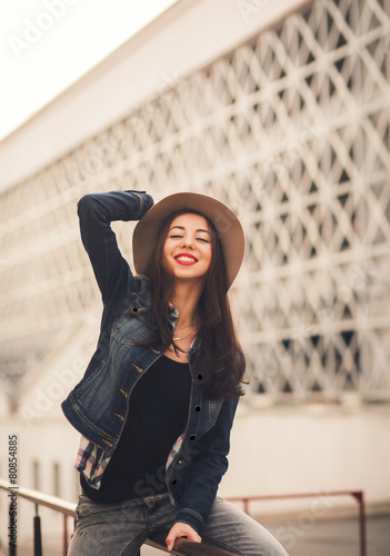 portrait of happy girl in hat. smiling toothy smile