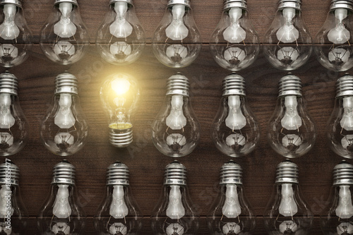 Obraz na plátně glowing bulb uniqueness concept