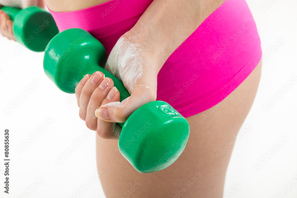 Fitness girl with green dumbbells Fitness girl with green dumbbells