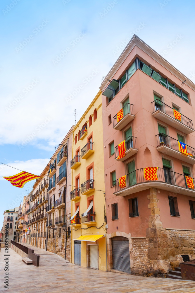Facades decorated with flags of  Tarragona and Catalonia