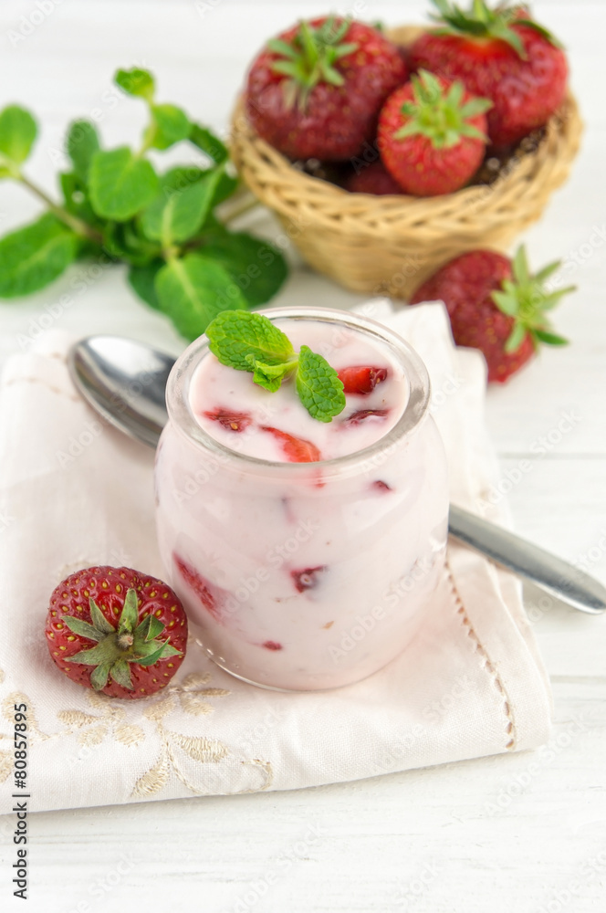 Strawberry yogurt with fresh fruits and mint leaves Strawberry yogurt with fresh fruits and mint leaves
