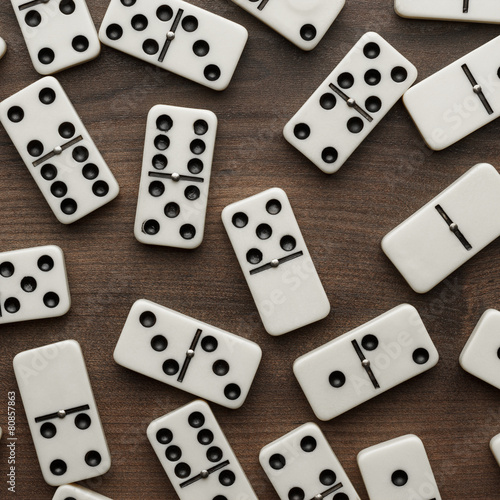 domino pieces on the wooden table background