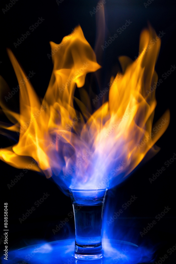 Fire cocktail on black background