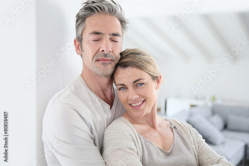 Portrait of mature couple relaxing at home © goodluz