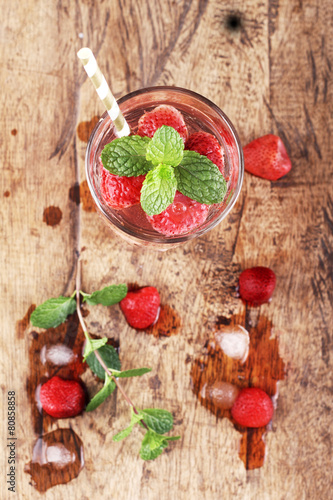strawberry drinks on wood background
