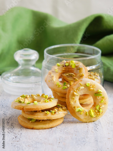 lemon cookies in the form of rings with pistachios and icing