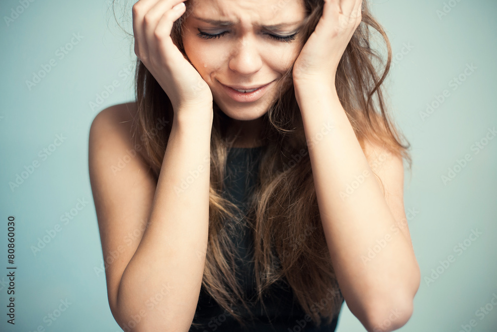 The upset woman loudly cries The upset woman loudly cries
