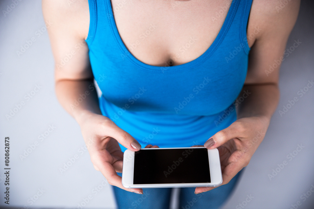 Closeup image of female hands holding smartphone Closeup image of female hands holding smartphone