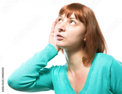 woman putting her finger to her lips for shh gesture photo