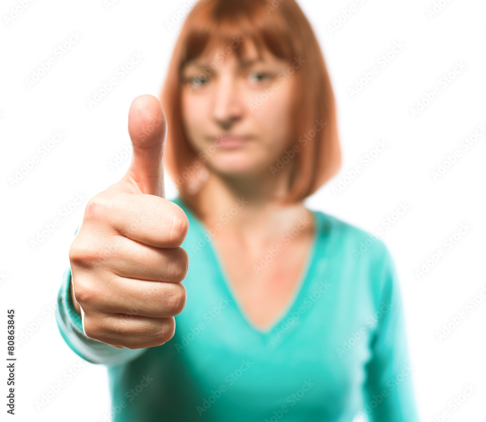 red-haired woman holding thumbs up red-haired woman holding thumbs up