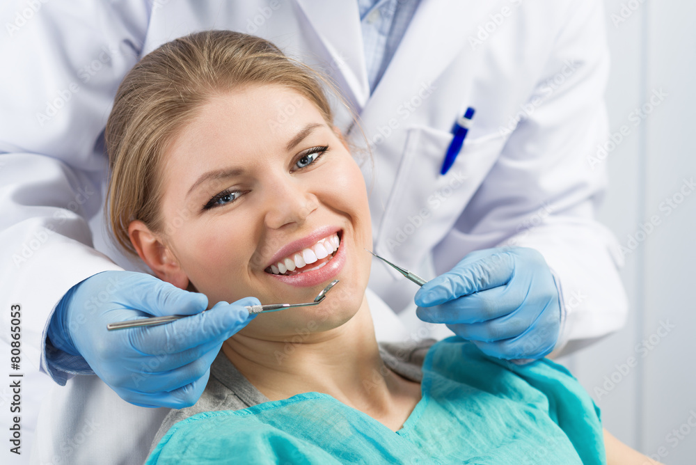 Close-up of happy smiling dental care woman visiting dentist Close-up of happy smiling dental care woman visiting dentist