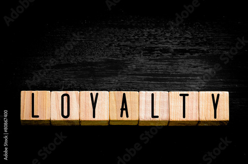 Word Loyalty isolated on black background