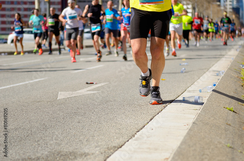 Marathon running race  runners feet on road  sport concept