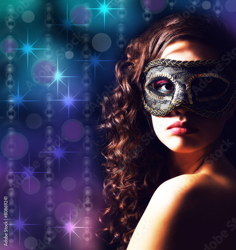 Beautiful girl with masquer...