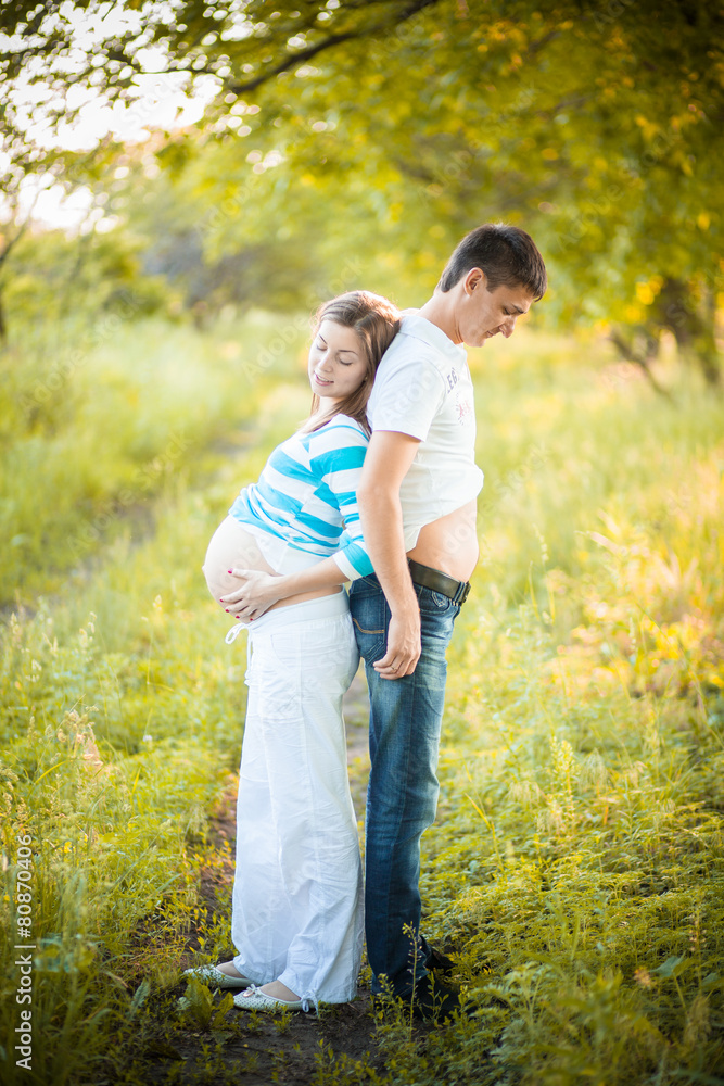 Fototapeta premium Pregnant couple on nature