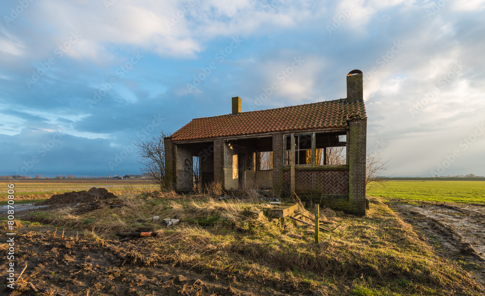Old partly scrapped building in low evening light Old partly scrapped building in low evening light