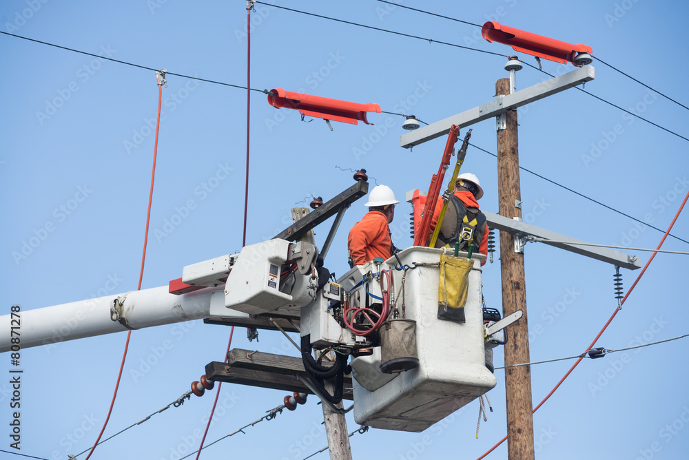 Aerial powerline workers StockFoto Adobe Stock