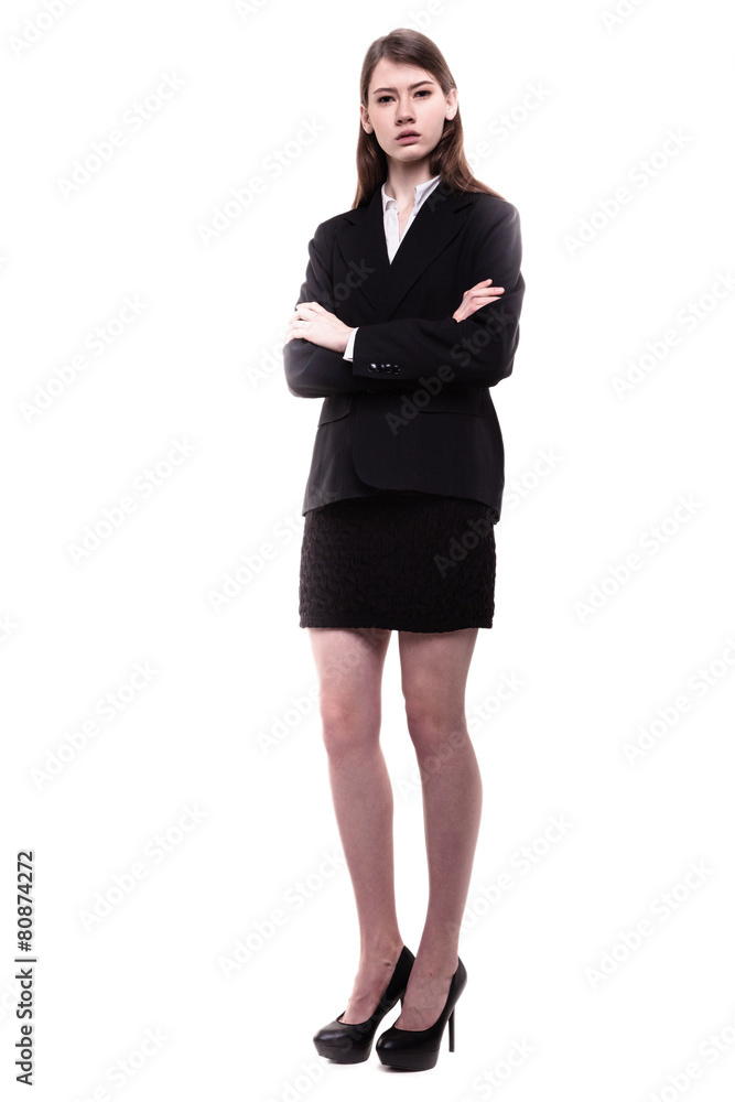 Confident young brunette businesswoman standing arms crossed Confident young brunette businesswoman standing arms crossed