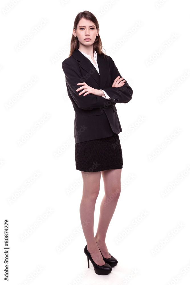 Confident young brunette businesswoman standing arms crossed Confident young brunette businesswoman standing arms crossed