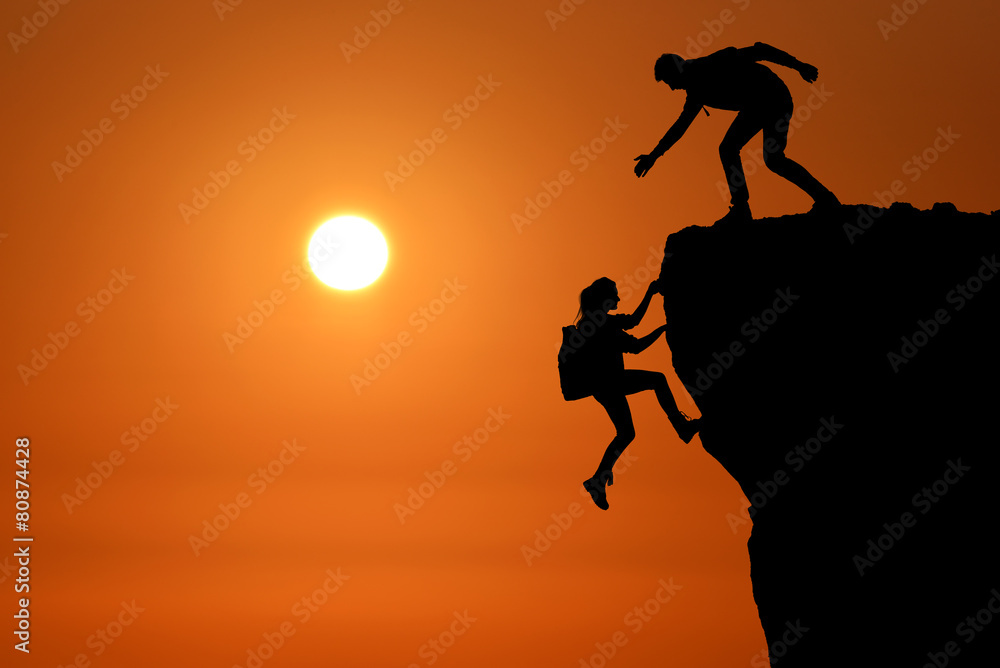 teamwork of two people man and girl travelers help on mountain teamwork of two people man and girl travelers help on mountain