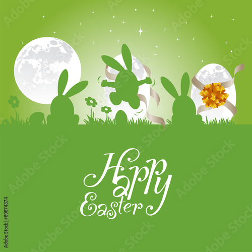 Easter related gold ribbon moon egg green background photo