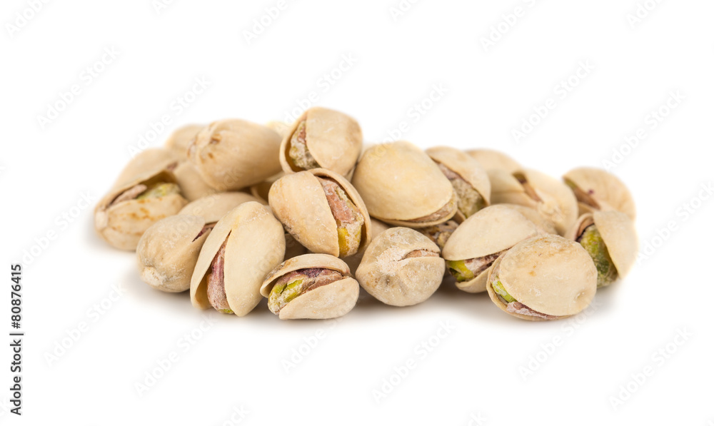 Heap of salted pistachio nuts Heap of salted pistachio nuts