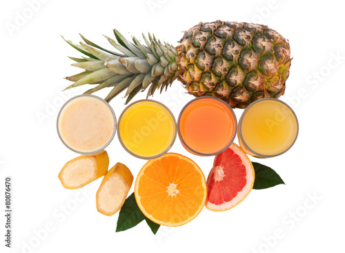 Tropical fruits and juice isolated on white