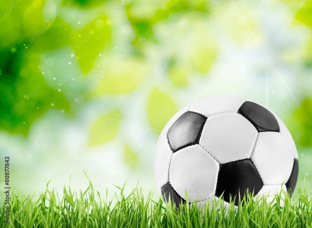 Naklejka premium Ball. Soccer ball on wooden background
