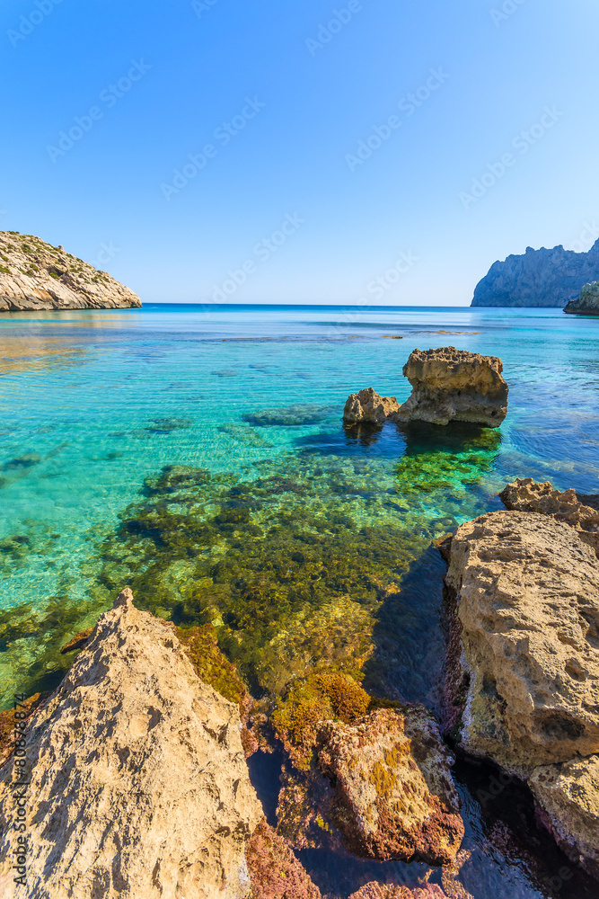 Rocks in turquoise sea water in Cala San Vicente, Majorca island