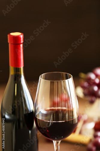 Bottle and glass of wine with grape