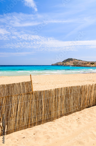 Wind fence on Cala Agulla beach  Majorca island  Spain
