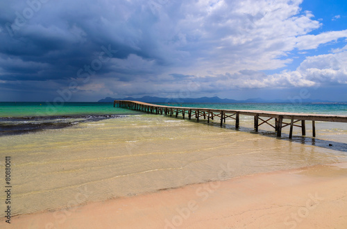 Fototapeta Naklejka Na Ścianę i Meble -  Wooden pier on Alcudia beach, Majorca island, Spain