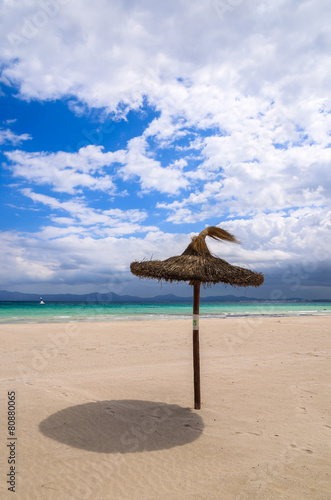 Umbrellas on sandy Alcudia beach, Majorca island, Spain