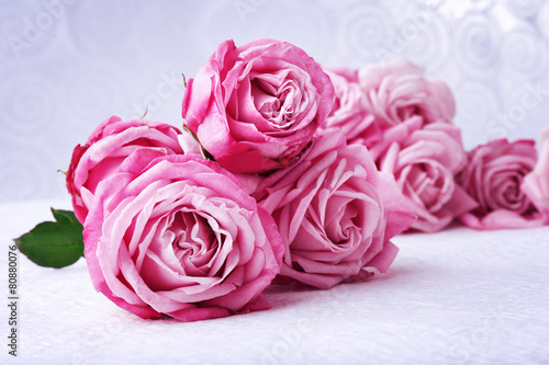 Bouquet of beautiful fresh roses on wooden table  closeup