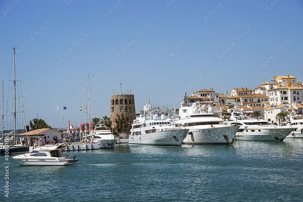 Luxury yachts and boats and water traffic in summer Puerto Banus, Spain