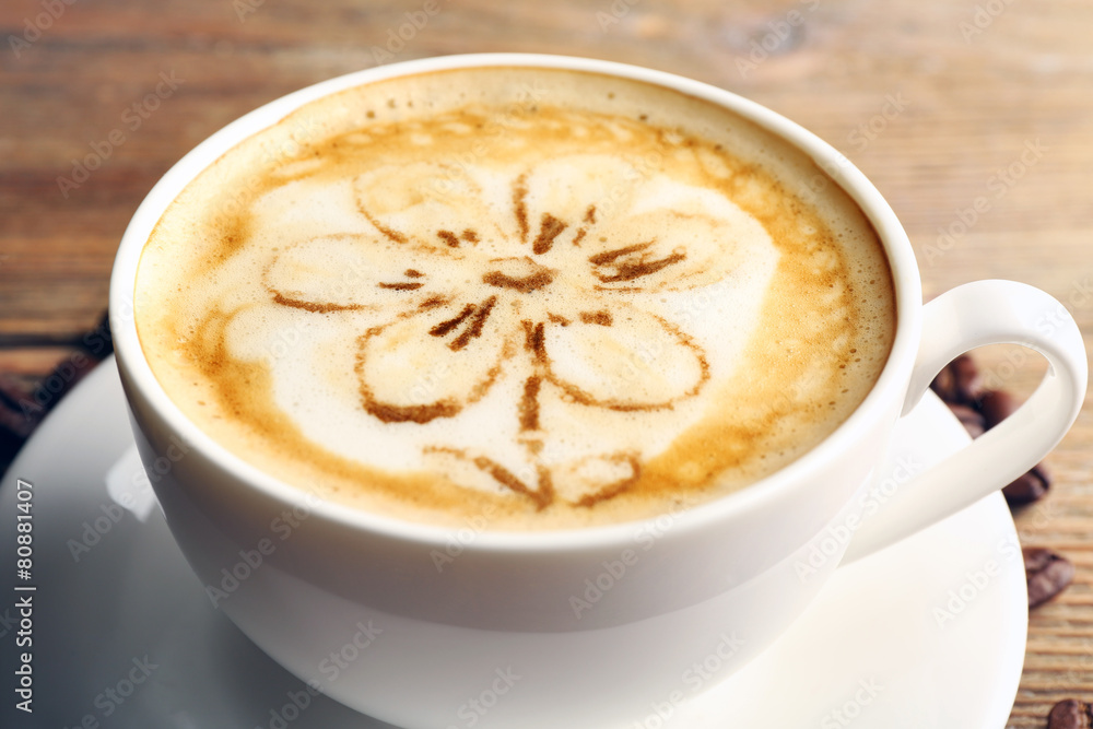 Cup of coffee latte art on wooden table, closeup Cup of coffee latte art on wooden table, closeup