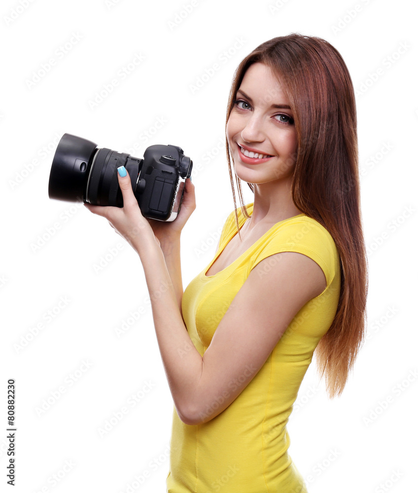 Young female photographer taking photos isolated on white Young female photographer taking photos isolated on white