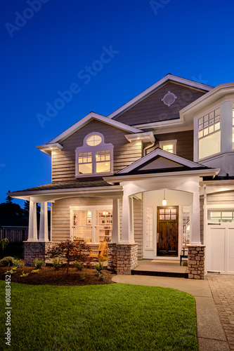 Beautiful New England Style Home Exterior at Night