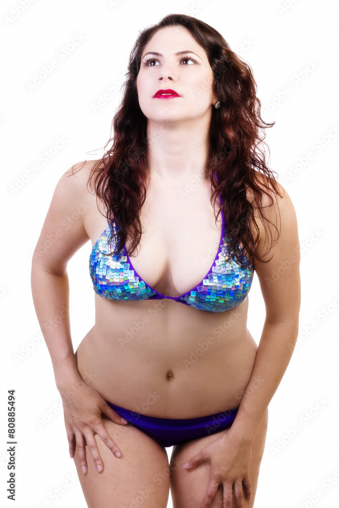 Fototapeta premium Caucasian Woman Standing In Blue Bikini Looking Up
