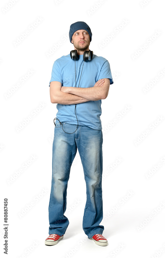 Fototapeta premium Bearded man in a cap and headphones on white background