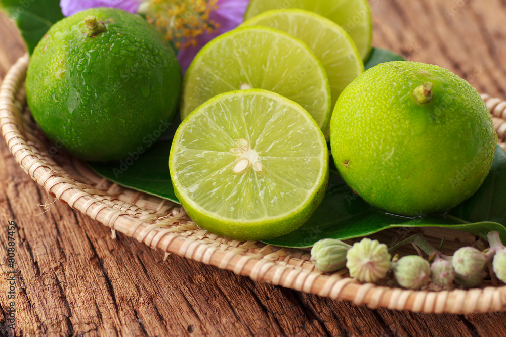 Lime on wooden background - Stock Image Lime on wooden background - Stock Image