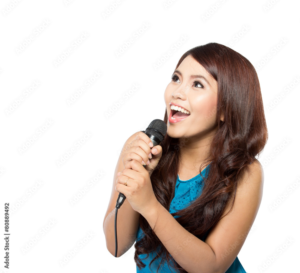 Young woman sing holding a mic, isolated Young woman sing holding a mic, isolated