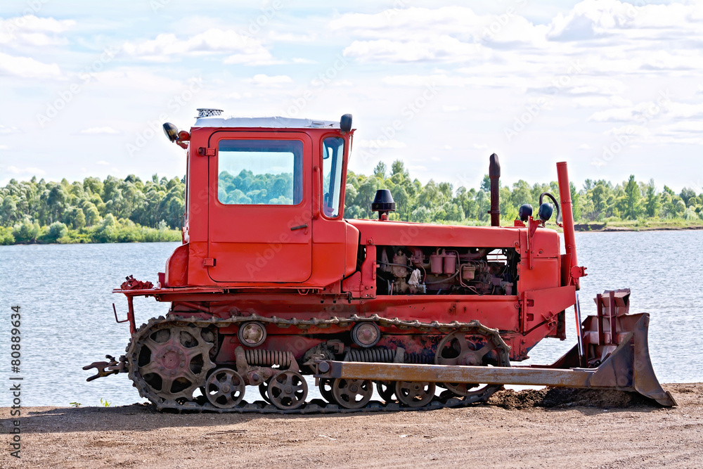 Bulldozer red by the river Bulldozer red by the river