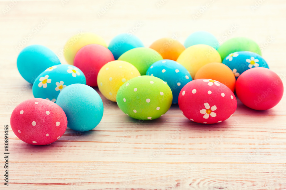 Easter eggs on white wooden desk. Festive background toning Easter eggs on white wooden desk. Festive background toning